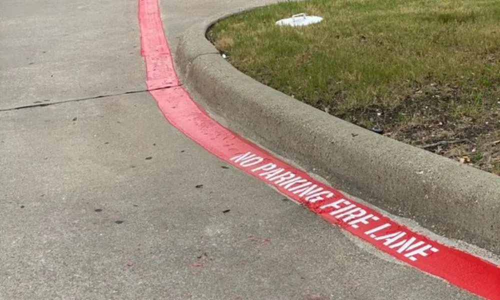 Fresh fire lane and no parking pavement markings in a commercial lot